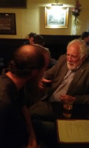 Shawn discussing the bending of light rays with another student
